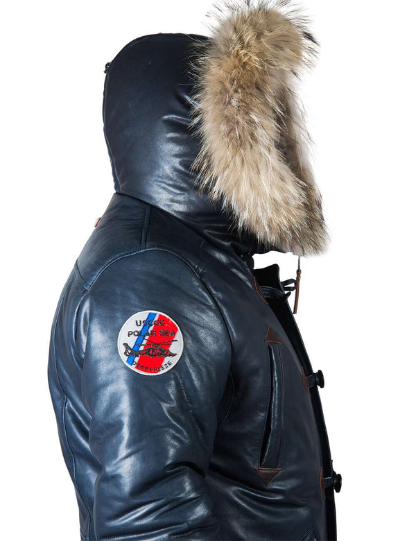 Side view of the top of a men's blue leather parka with a raccoon fur trimmed hood.