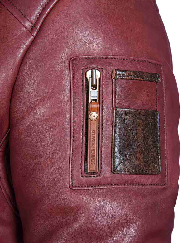 Utility pocket on the left sleeve of a burgundy men's leather jacket.