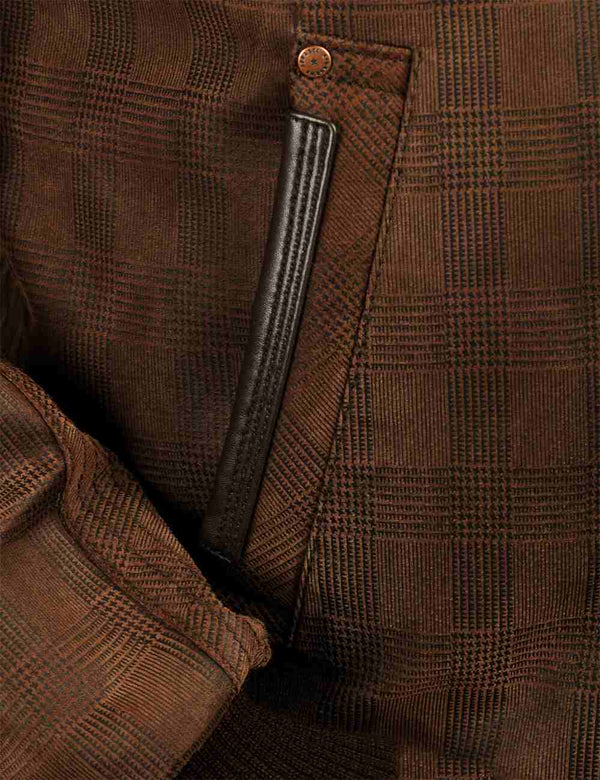Pocket of a brown leather jacket.