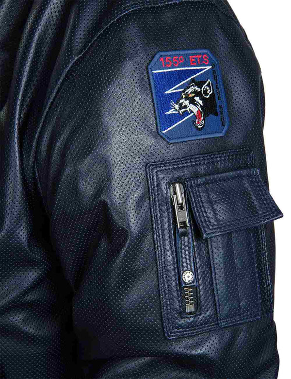 A utility pocket and patch on the left sleeve of a dark blue men's perforated leather jacket.