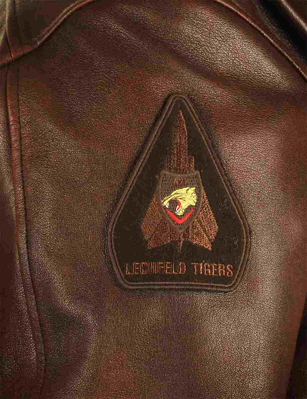 Patch on a brown leather jacket.