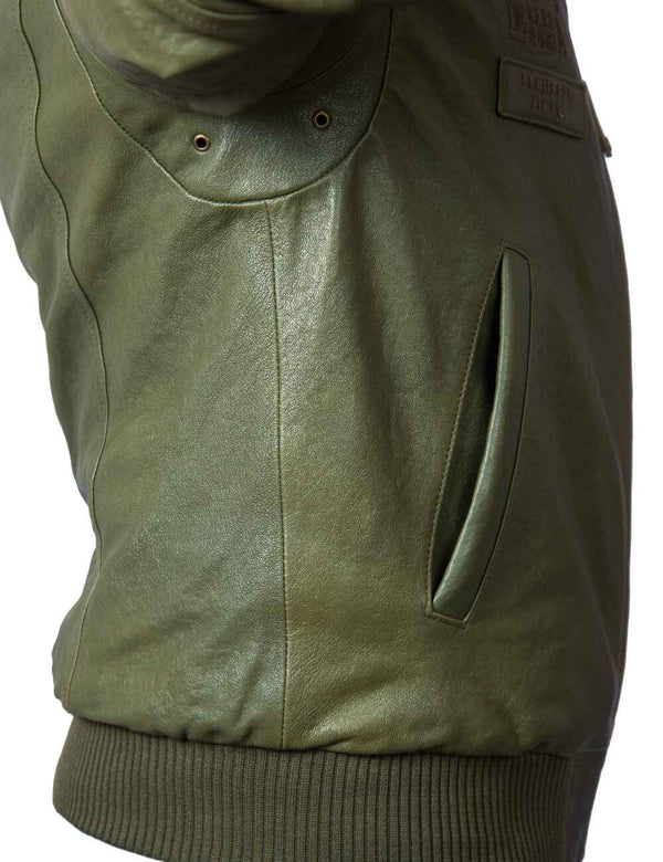 Underarm area of men's olive leather jacket with elastic band.
