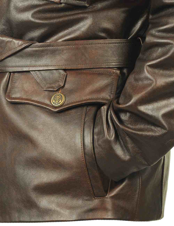 Lower pocket of a men's brown leather coat with a belt.