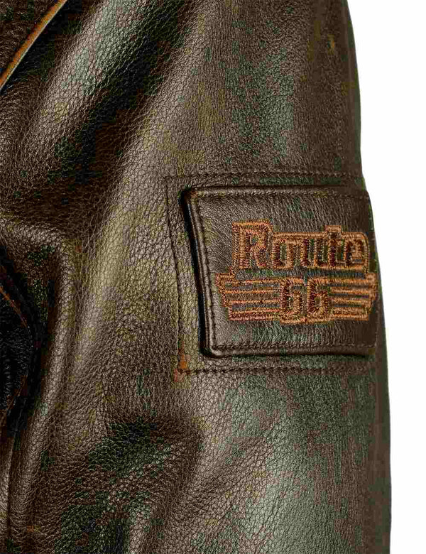 Patch on the left sleeve of a men's brown leather jacket.