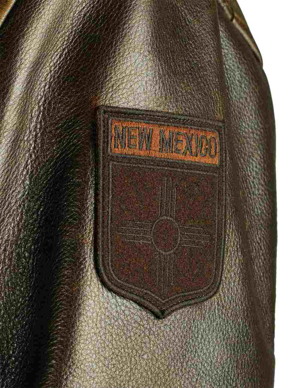Patch on the left sleeve of a men's brown leather jacket.