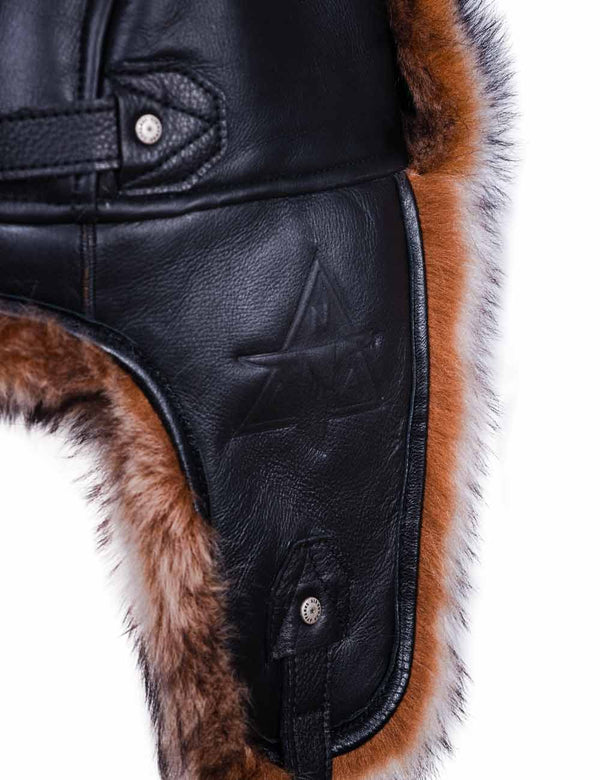 Black leather hat with brown fur.