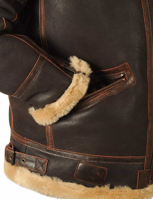 The lower right side of a men's brown sheepskin coat, with the sleeve in the pocket.
