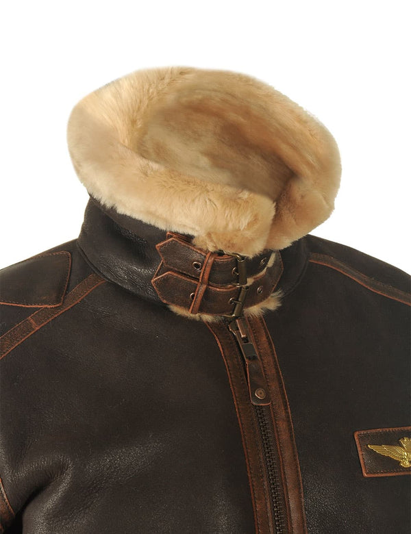 The top of a men's brown sheepskin coat with a raised and buttoned collar.