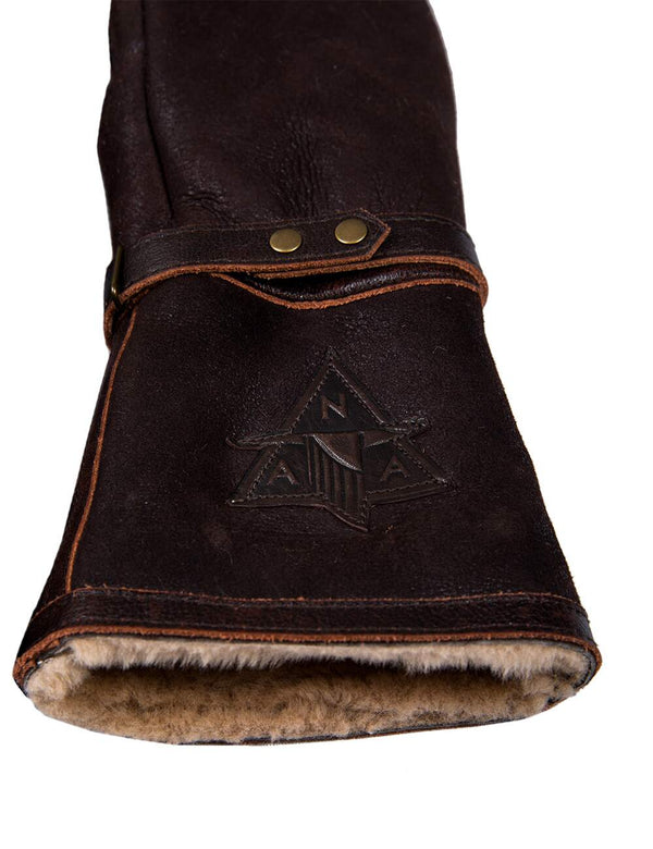 Patch on brown men's leather gloves with fur.