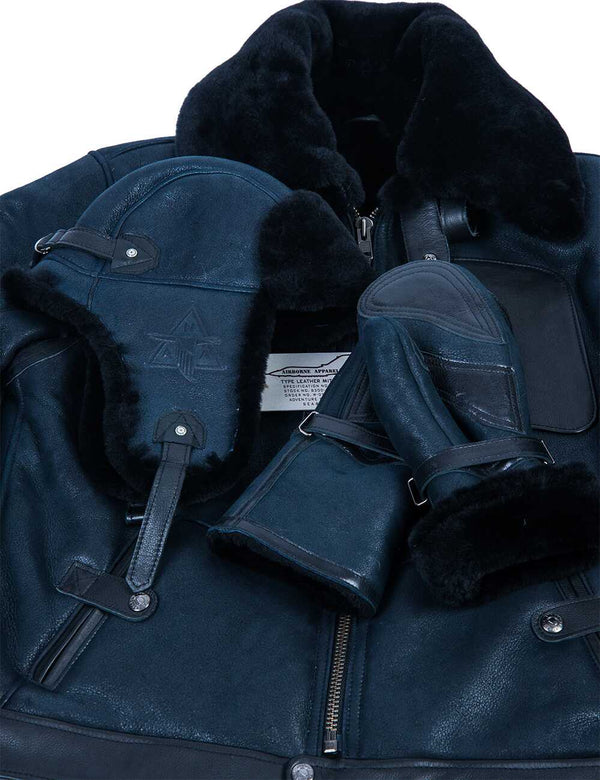 A blue men's sheepskin jacket with a blue ushanka and fur mittens on top.