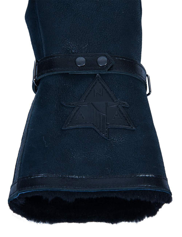 Patch on a blue men's sheepskin mitten.