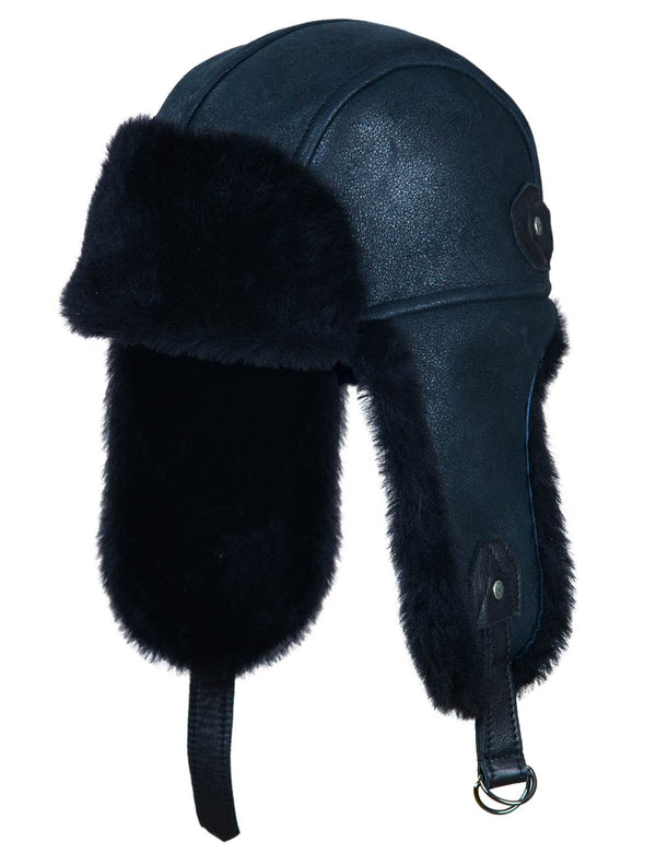 Navy blue leather aviator hat with black fur trim on a white background.