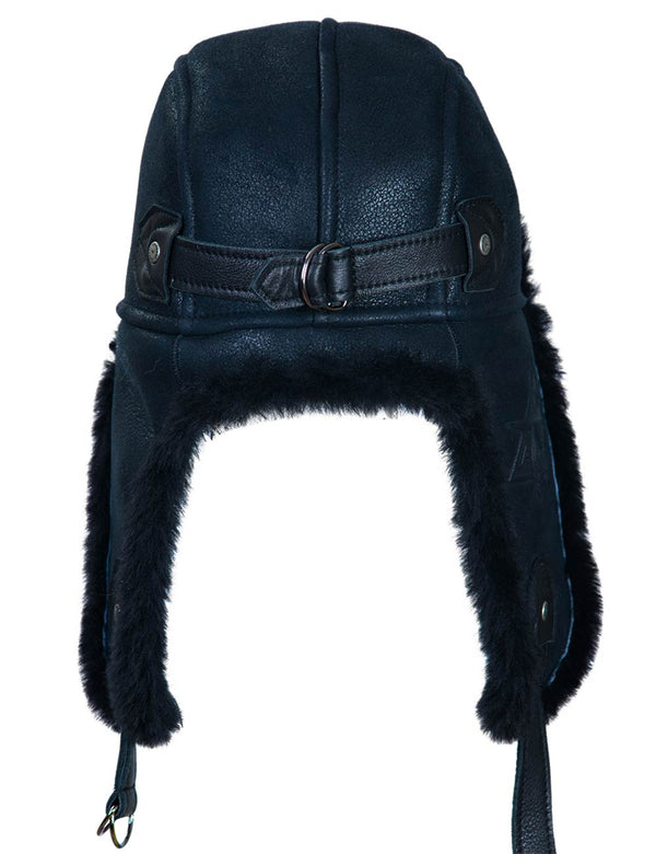 Navy blue leather aviator hat with black fur trim on a white background.
