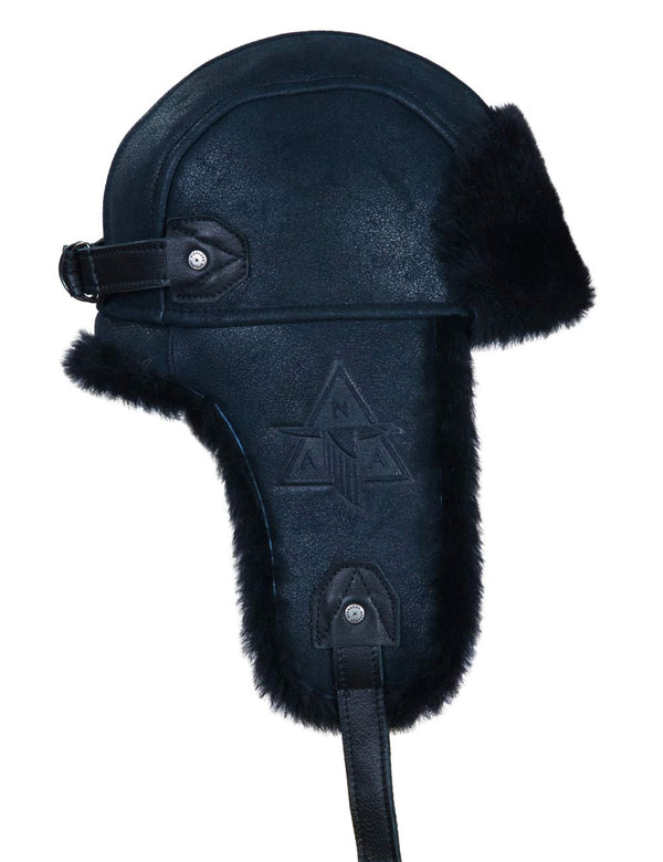 Navy blue leather aviator hat with black fur trim on a white background.