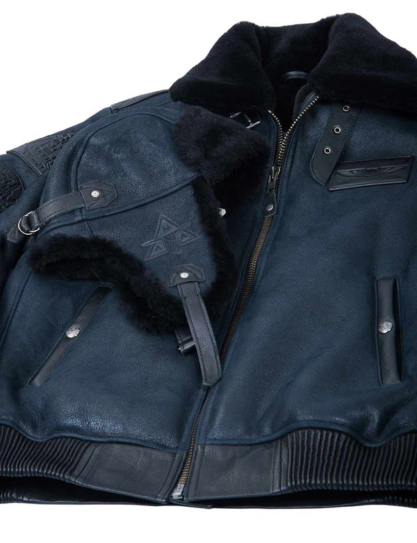 Dark blue shearling jacket and hat with fur lining on a white background.