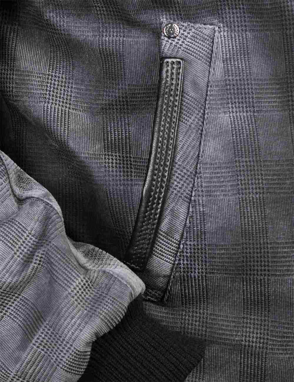 Pocket of a grey leather jacket.