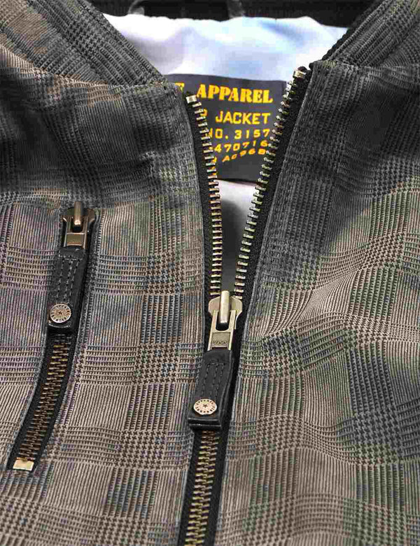 Metal zipper on grey leather jacket.