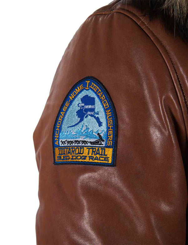 Patch on the sleeve of a light brown men's leather parka.
