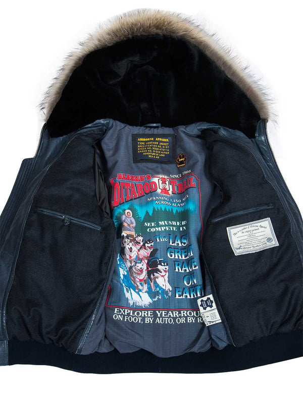Men's blue short leather parka with raccoon fur trimmed hood, unbuttoned, revealing bright lining and inside pockets.