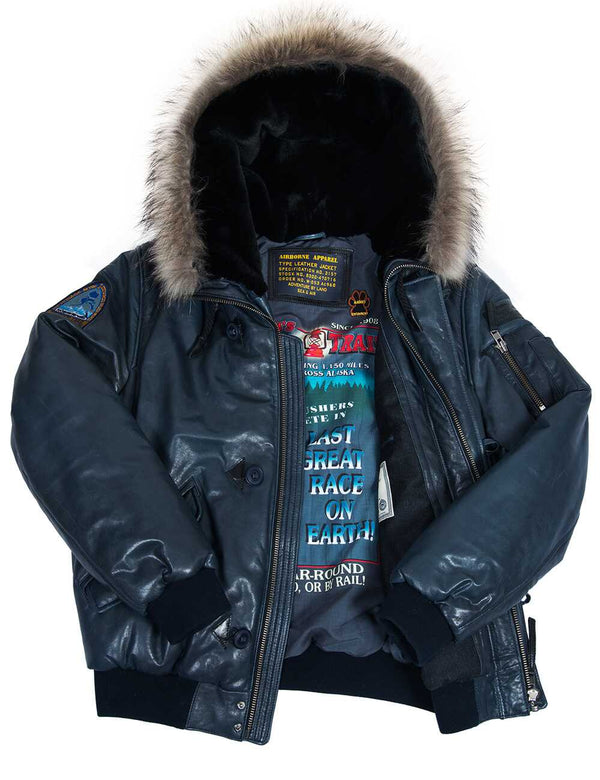 Men's blue short leather parka with raccoon fur trimmed hood, unbuttoned.