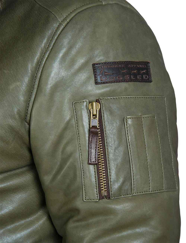 Shoulder of the olive leather down jacket with brown rectangular patch and utility pocket.