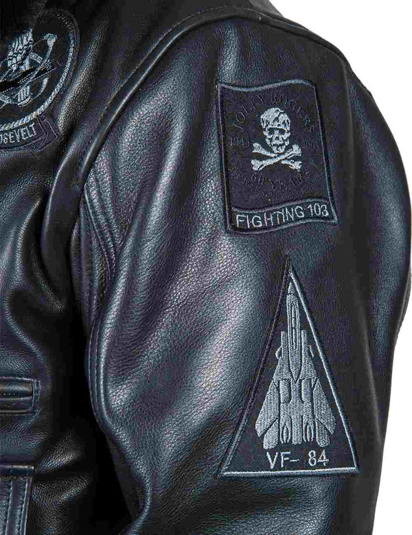 Patches on the sleeve of a men's black leather jacket.