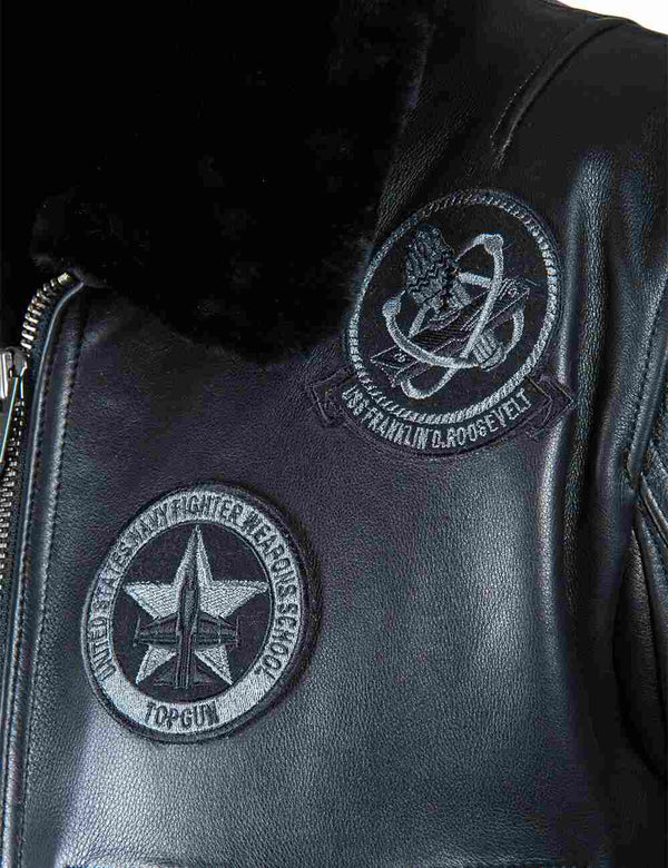 Patches on the chest of a men's black leather jacket with a fur collar.