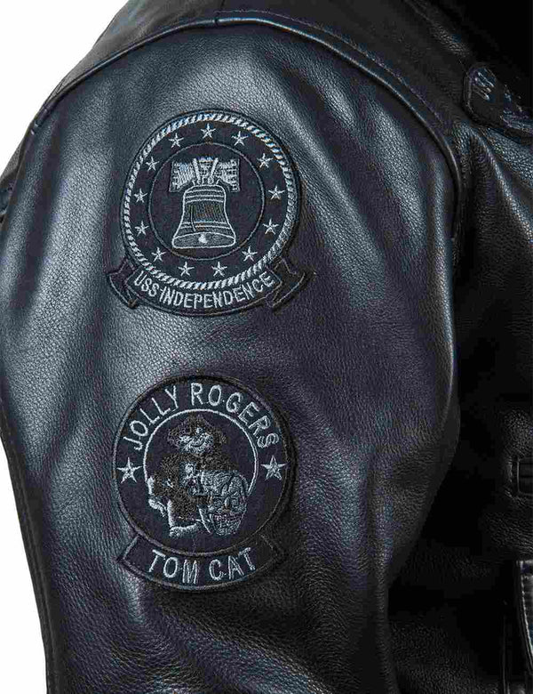 Patches on the sleeve of a men's black leather jacket.
