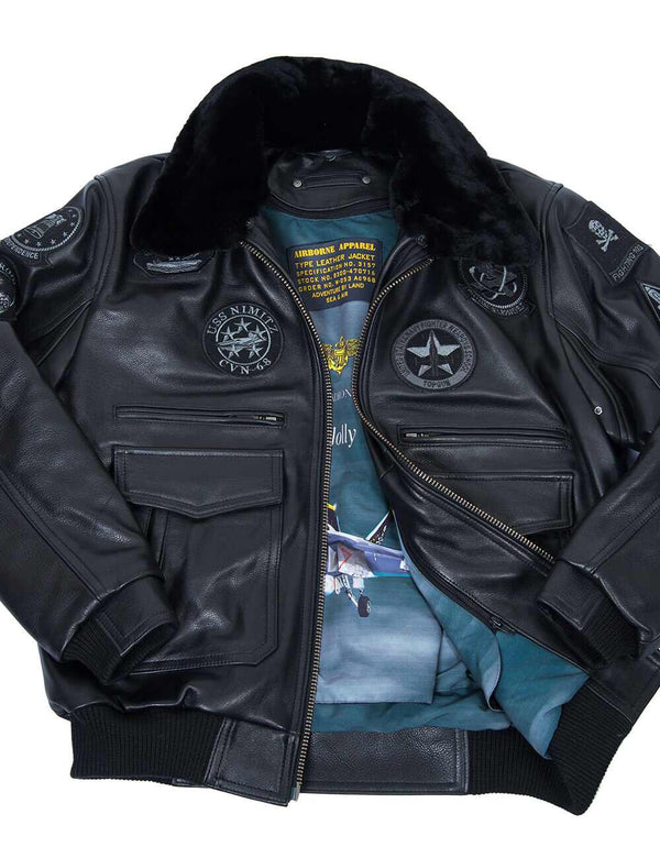 Men's black leather jacket with fur collar and patches, unbuttoned, revealing a bright blue lining.