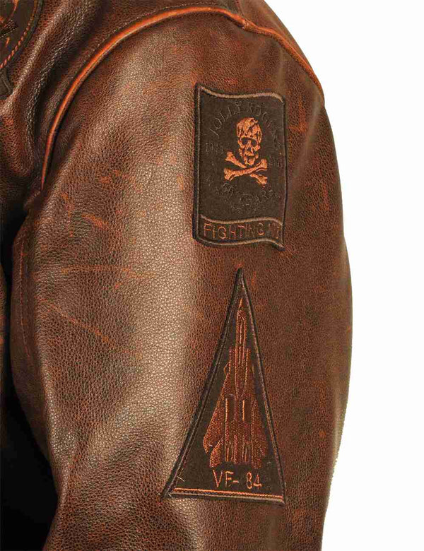 Patches on the left sleeve of a brown leather jacket.