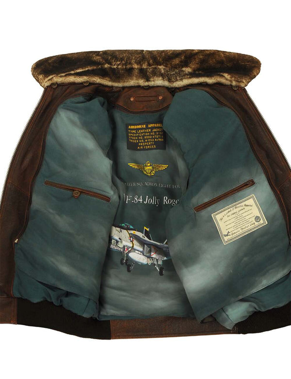 Men's brown leather jacket with fur collar unbuttoned, revealing removable lining and internal pockets.