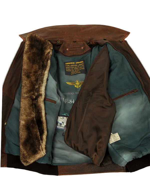 Men's brown leather jacket with fur collar unbuttoned, revealing removable lining and internal pockets.