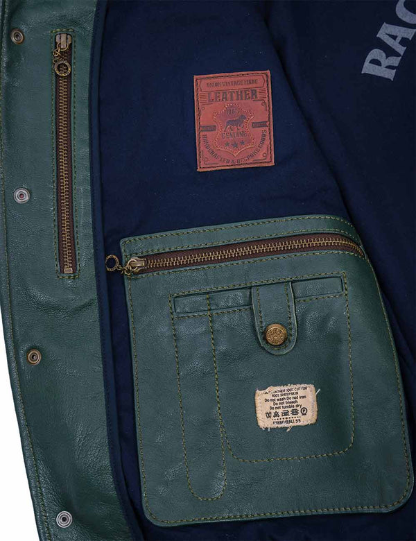 Internal pockets with iron zippers on a men's green leather jacket.