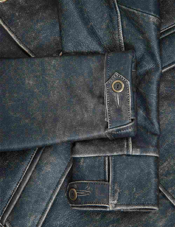 Sleeves of a black men's leather jacket with bleached seams.