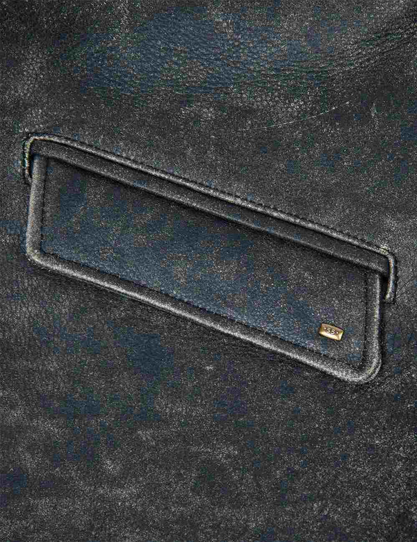 Flap pocket on black men's leather jacket with highlighted seams.