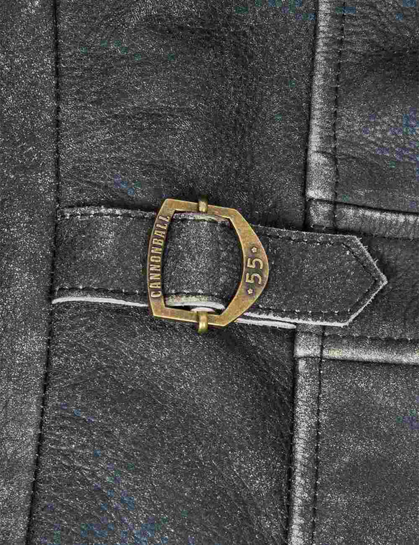 Metal clasp on black men's leather jacket with bleached seams.