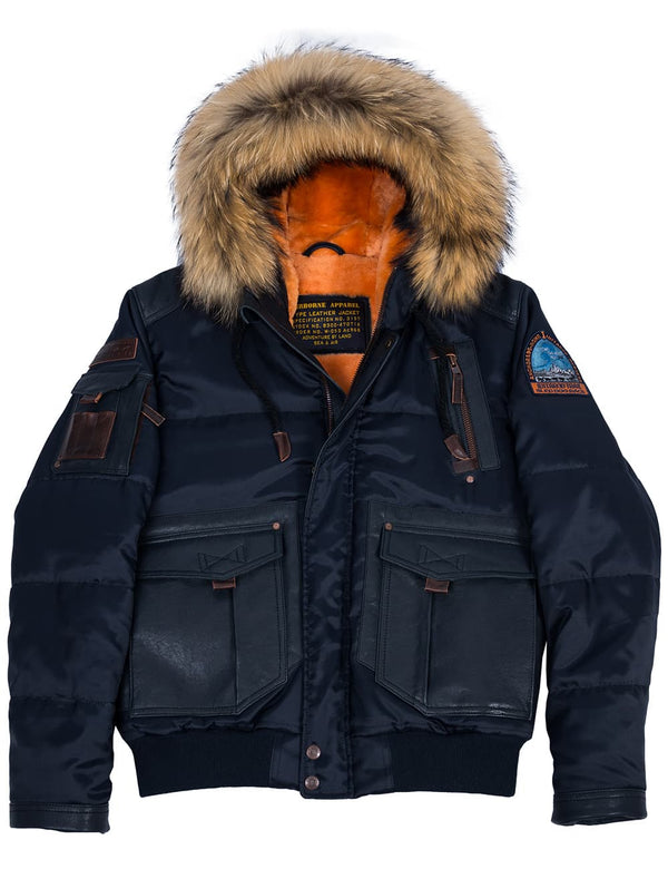 Men's dark blue short jacket with a hood trimmed with raccoon fur, with an orange fur lining visible inside.