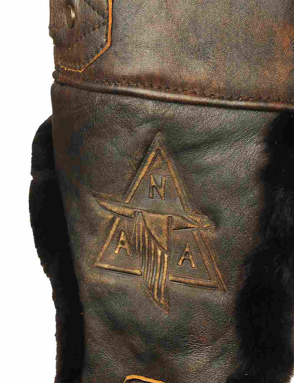 Leather embossing on a sheepskin trapper hat