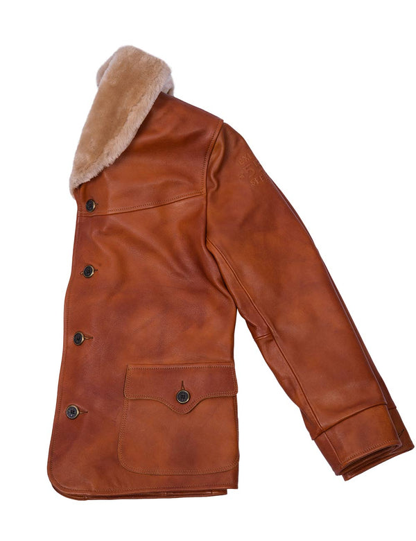 Left side of men's light brown buttoned leather jacket with fur collar.