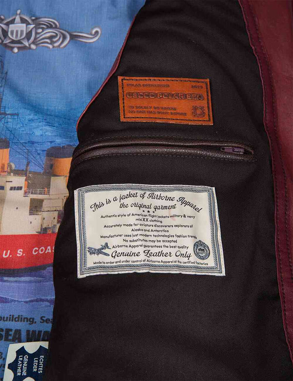 Inside pocket and lining of a men's burgundy leather vest.