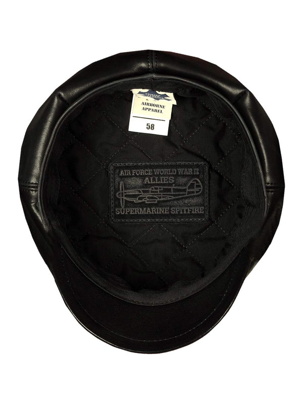 Men's black leather cap, view from the inside, showing the lining with the patch.