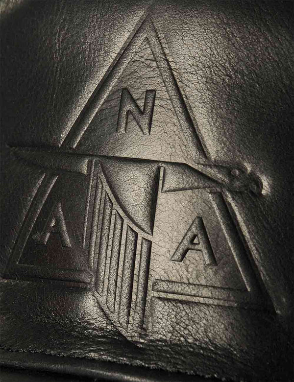 Embossing on a black men's leather cap.