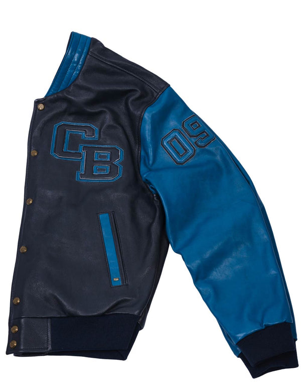 The left part of a men's dark blue leather jacket has a light blue sleeve and trim, also with patches on the chest and sleeve.