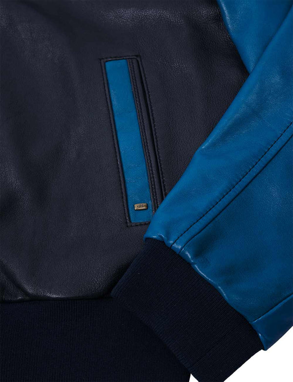 Bottom left side of a men's dark blue leather jacket with a light blue sleeve and pocket trim.