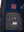 Inside zipped pockets of men's black leather jacket with blue lining.