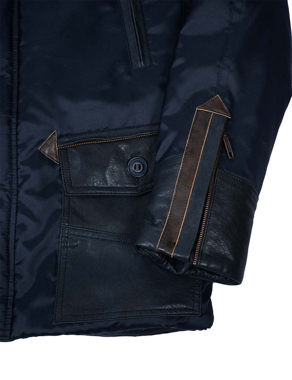 The lower part of the sleeve and the lower pocket of the men's dark blue parka.