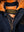 Metal zipper on a men's dark blue jacket with an orange fur lining.