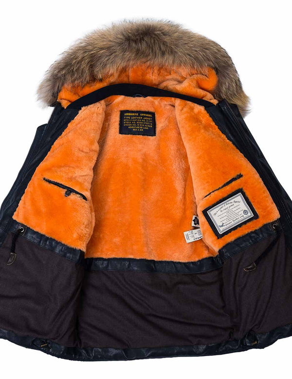 Men's navy blue parka with a raccoon fur trimmed hood, unbuttoned, revealing an orange fur lining.