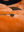 Orange fur lining on men's dark blue jacket.