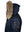 Men's dark blue parka with raccoon fur trimmed hood, side view.